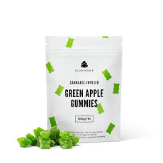A close-up image of BuudaBomb Green Apple Gummies, with the white packaging featuring small green gummy bears and a pile of green apple-flavored gummies in front