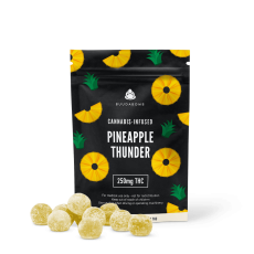 BuudaBomb Pineapple Thunder gummies package with pineapple-themed design, displaying a few round yellow gummies in front