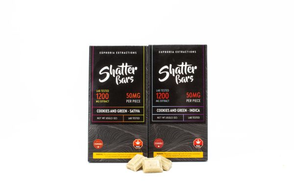 Two Shatter Bars 1200mg THC packages in Cookies and Green flavor, available in Sativa and Indica varieties, accompanied by white chocolate pieces.