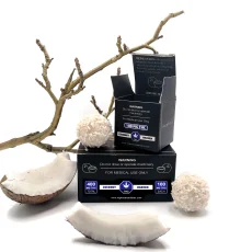 High Heals Coconut Heaven THC truffles box open with coconut truffles and coconut pieces arranged nearby. The packaging shows '100mg THC per truffle' and '400mg THC total' with medical warnings