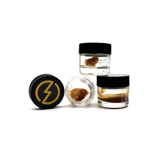 Three jars of High Voltage Extracts Live Resin displayed in various positions. The black lids feature a yellow lightning bolt logo, with one jar open showcasing the live resin inside