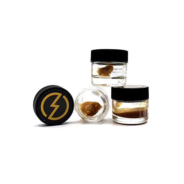 Three jars of High Voltage Extracts Live Resin displayed in various positions. The black lids feature a yellow lightning bolt logo, with one jar open showcasing the live resin inside