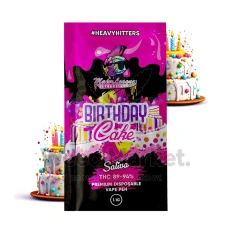 Major League Extractions Birthday Cake-flavored Sativa disposable vape pen packaging, featuring a festive design with birthday cake imagery and balloons. The vape pen contains 89-94% THC, labeled as a 1.1g premium disposable vape pen under the #HeavyHitters label.