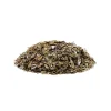 A pile of dried, loose tea leaves infused with Amazonian Cubensis mushrooms, used for making MOTA Room 920 Magic Mushroom Tea