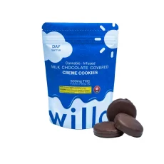 A blue bag of Willo cannabis-infused milk chocolate-covered creme cookies labeled for daytime (sativa), featuring a sun design. The package displays 500mg THC (5 cookies x 100mg each), with three chocolate-covered cookies placed beside it.