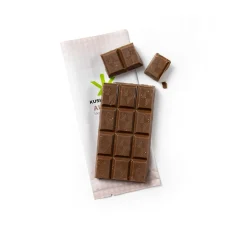 Unwrapped Kush Kitchen Almond THC Chocolate Bar Milk chocolate with almonds broken into squares placed on branded packaging