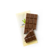 Unwrapped Kush Kitchen Banana Caramel THC Chocolate Bar Milk chocolate bar with banana caramel broken into squares on its packaging