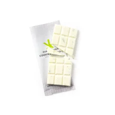 Unwrapped Kush Kitchen Cookies and Cream THC Chocolate Bar White chocolate bar with cookie pieces broken into squares on its packaging