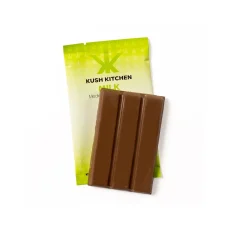 Kush Kitchen Milk chocolate bar unwrapped showing smooth chocolate with 200mg THC on green packaging.