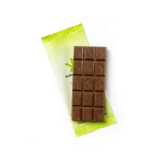 Unwrapped Kush Kitchen Milk THC Chocolate Bar Smooth milk chocolate bar resting on its light green wrapper