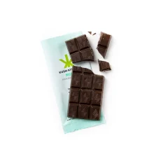 Unwrapped Kush Kitchen Mint THC Chocolate Bar Dark chocolate bar with a minty aroma broken into pieces on its wrapper