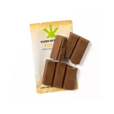 Kush Kitchen Toffee chocolate bar broken into smaller pieces showing 200mg THC on beige packaging.