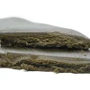 Cracked Zen Hash bar revealing its soft, crumbly interior and rich brown tone.