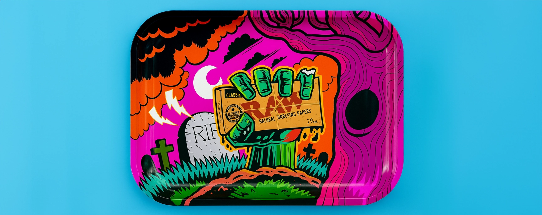 Colorful RAW rolling tray with zombie hand artwork on blue background.