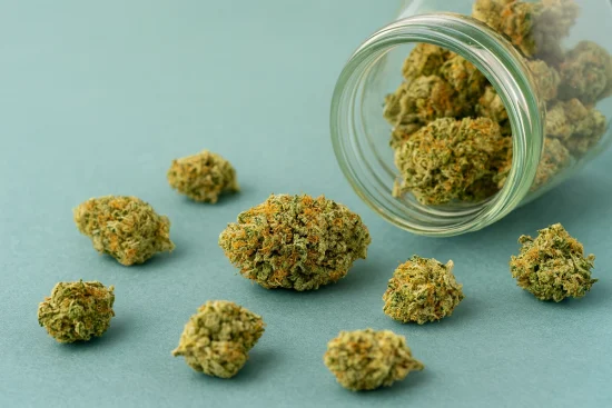 Craft weed Canada flower spilled from glass jar – Weed Market premium cannabis