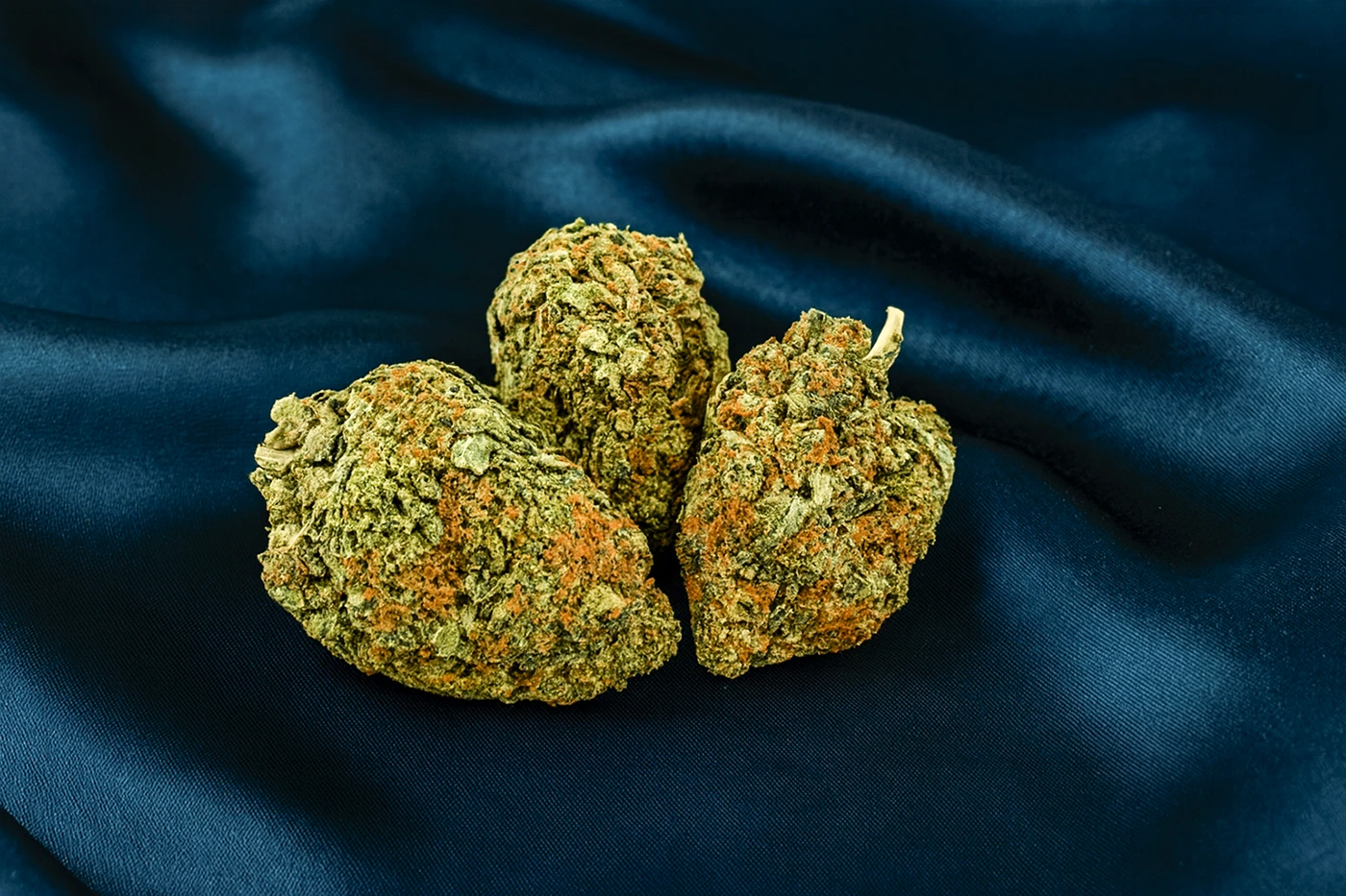 Premium craft weed Canada cannabis buds on dark silk background – high-quality flower from Weed Market online dispensary.